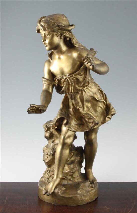 A late Victorian bronze figure of a girl standing beside a rock, H.19.5in.